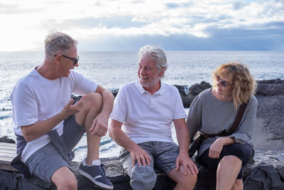 Friends sitting on beach