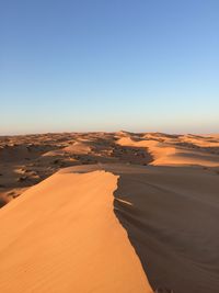 Scenic view of desert against clear sky