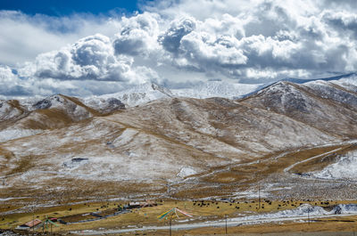 Scenic view of snowcapped mountains against sky