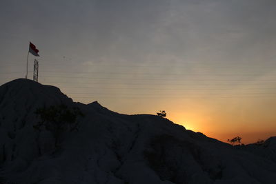 Scenic view of silhouette landscape against sky during sunset
