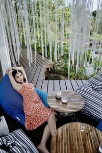 Woman sitting on chair at table
