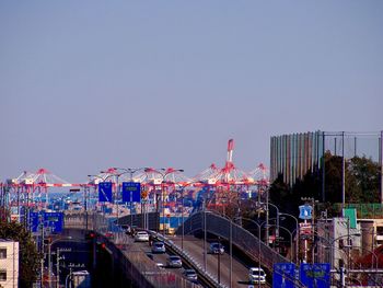 View of cityscape against clear blue sky
