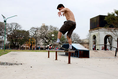 Young skateboarder sliding