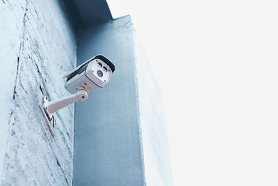 Close-up of security camera on wall