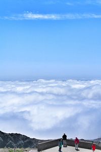 Scenic view of mountains against cloudy sky