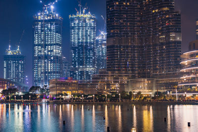 Illuminated buildings in city at night