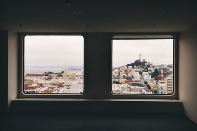 View of cityscape through window