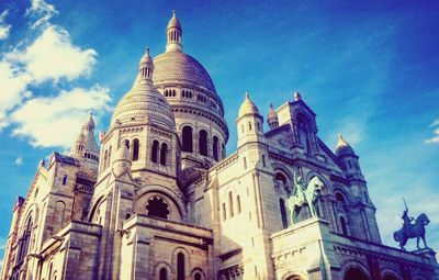 Low angle view of church against blue sky