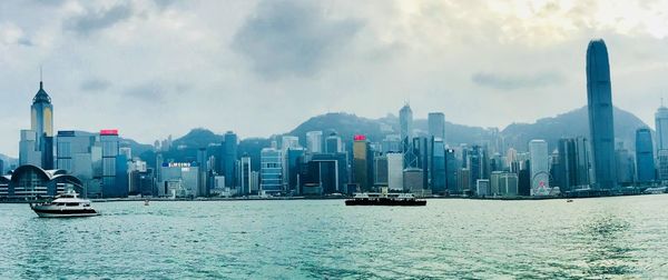 Panoramic view of buildings against sea