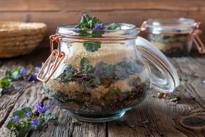 Close-up of ice cream in glass jar on table