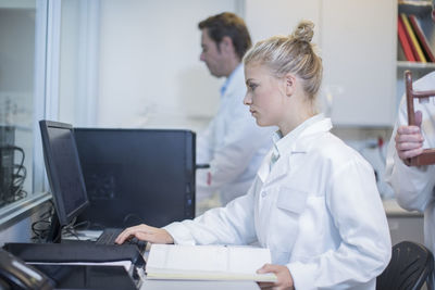 Young woman working on computer in lab