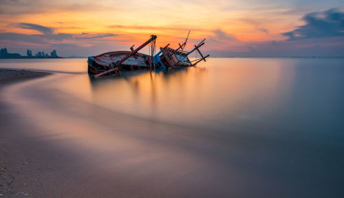 Scenic view of sea against sky during sunset