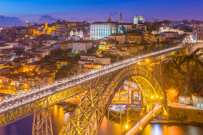 High angle view of illuminated buildings in city at night