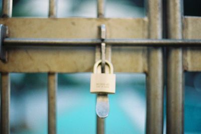 Close-up of padlocks on metal attached