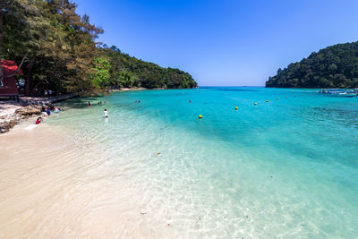 Scenic view of sea against clear blue sky