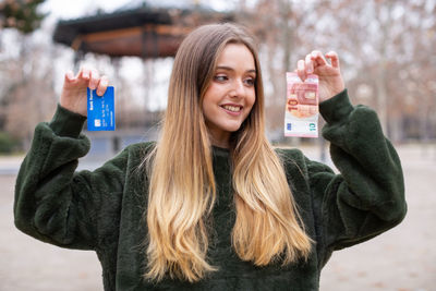 Portrait of a smiling young woman in winter