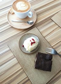 High angle view of fresh food and coffee served on table