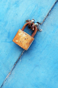 Close-up of rusty lock on metal door