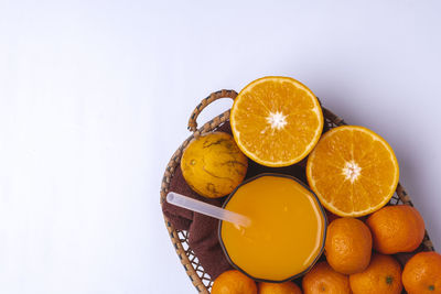 High angle view of oranges against white background