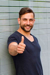 Portrait of young man standing outdoors