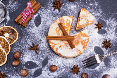 High angle view of cake with cinnamons with star anise