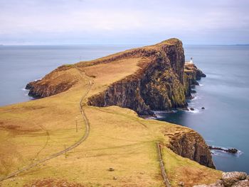 Sunrise over the neist point lighthouse. popular photographers location on isle of skye in scotland