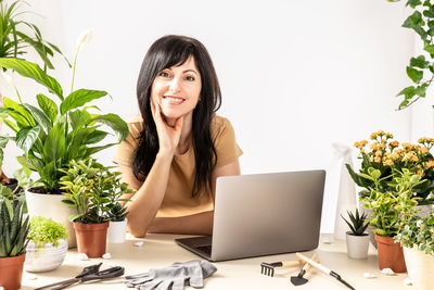 Young woman using laptop on table