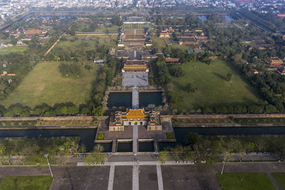 High angle view of trees and buildings in city