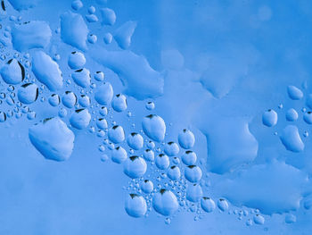 Close-up of ice crystals against blue background