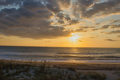 Scenic view of sea against sky during sunset