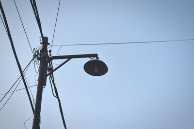 Low angle view of street light against clear sky