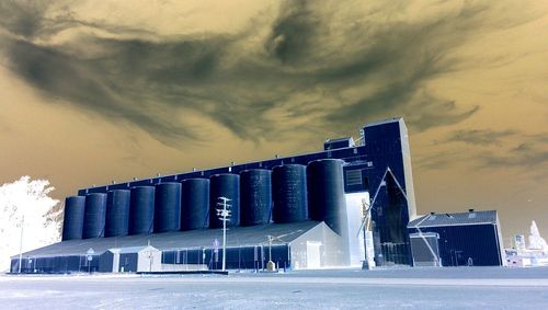 Low angle view of building against cloudy sky