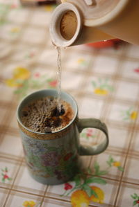 High angle view of coffee cup on table