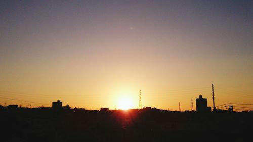 Cityscape against sky during sunset