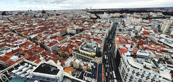 High angle view of crowd in city against sky