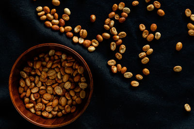 Selecting coffee beans thoroughly, picture on a black background