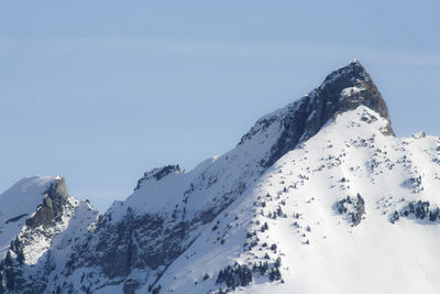 Scenic view of snow covered mountain against sky