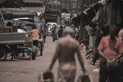 People walking on street in city