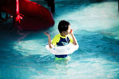 Boy in swimming pool