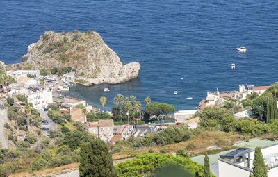 High angle view of townscape by sea