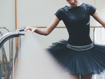 Young ballet dancer practicing in studio