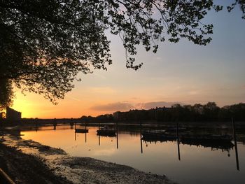 Scenic view of lake against sky during sunset