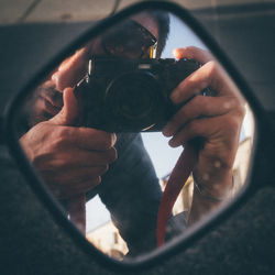 Man photographing through camera