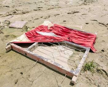 High angle view of garbage on sand