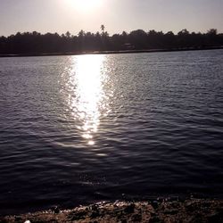 Scenic view of lake at sunset