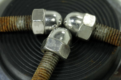 Close-up of bolts on table
