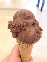 Cropped image of person holding ice cream