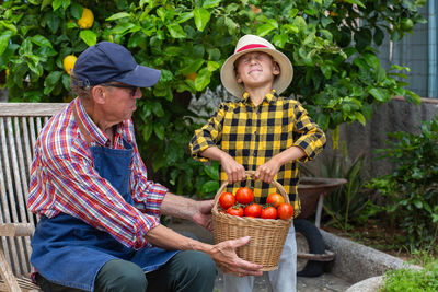 Portrait of senior woman picking apples