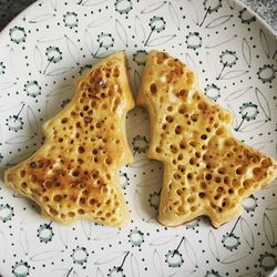 High angle view of christmas tree shape toasted bread in plate