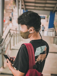 Young man using mobile phone